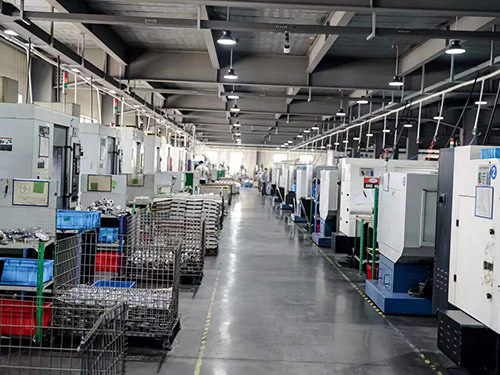 CNC machining workshop with rows of CNC machines